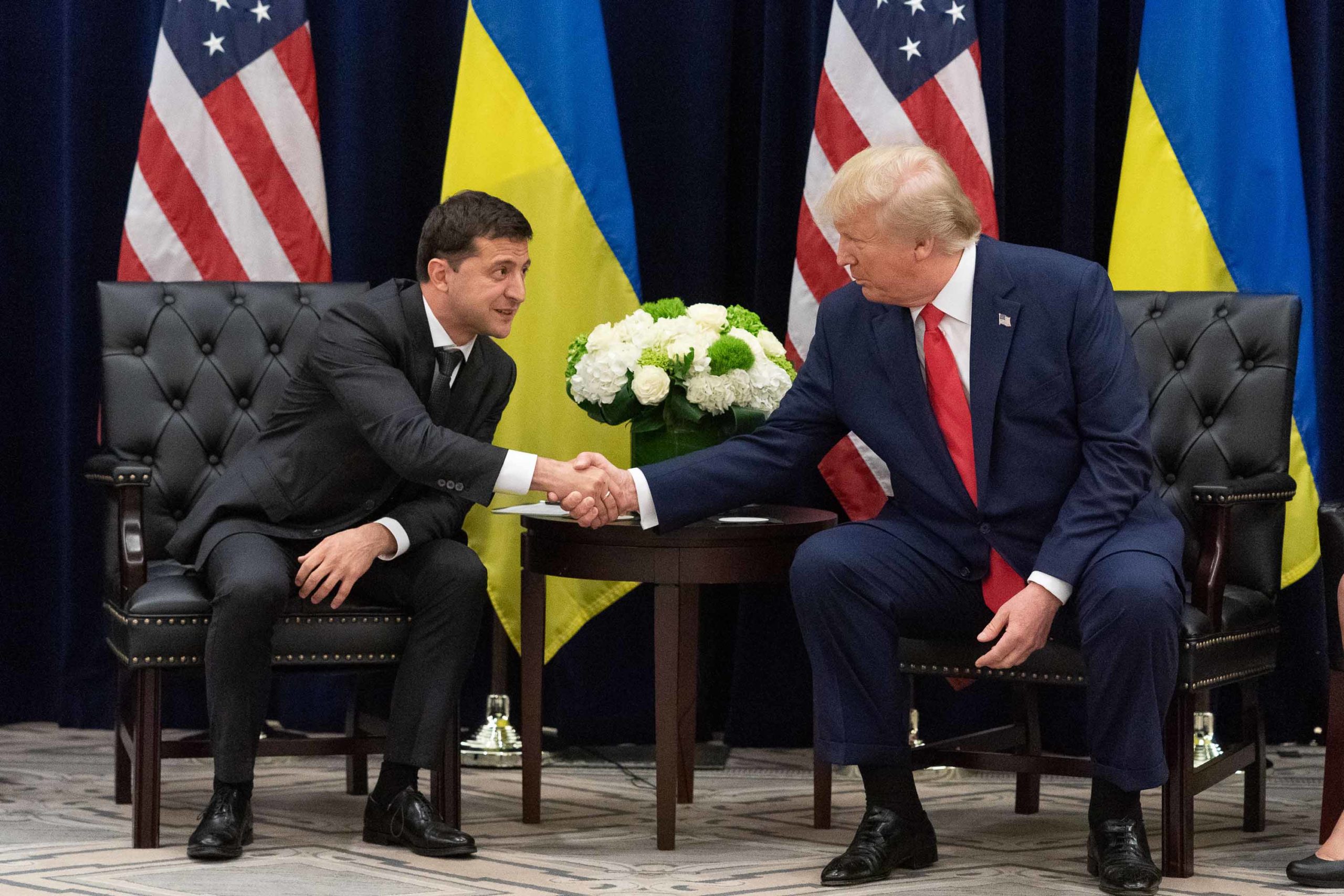 Volodymyr Zelensky and Donald Trump shaking hands
