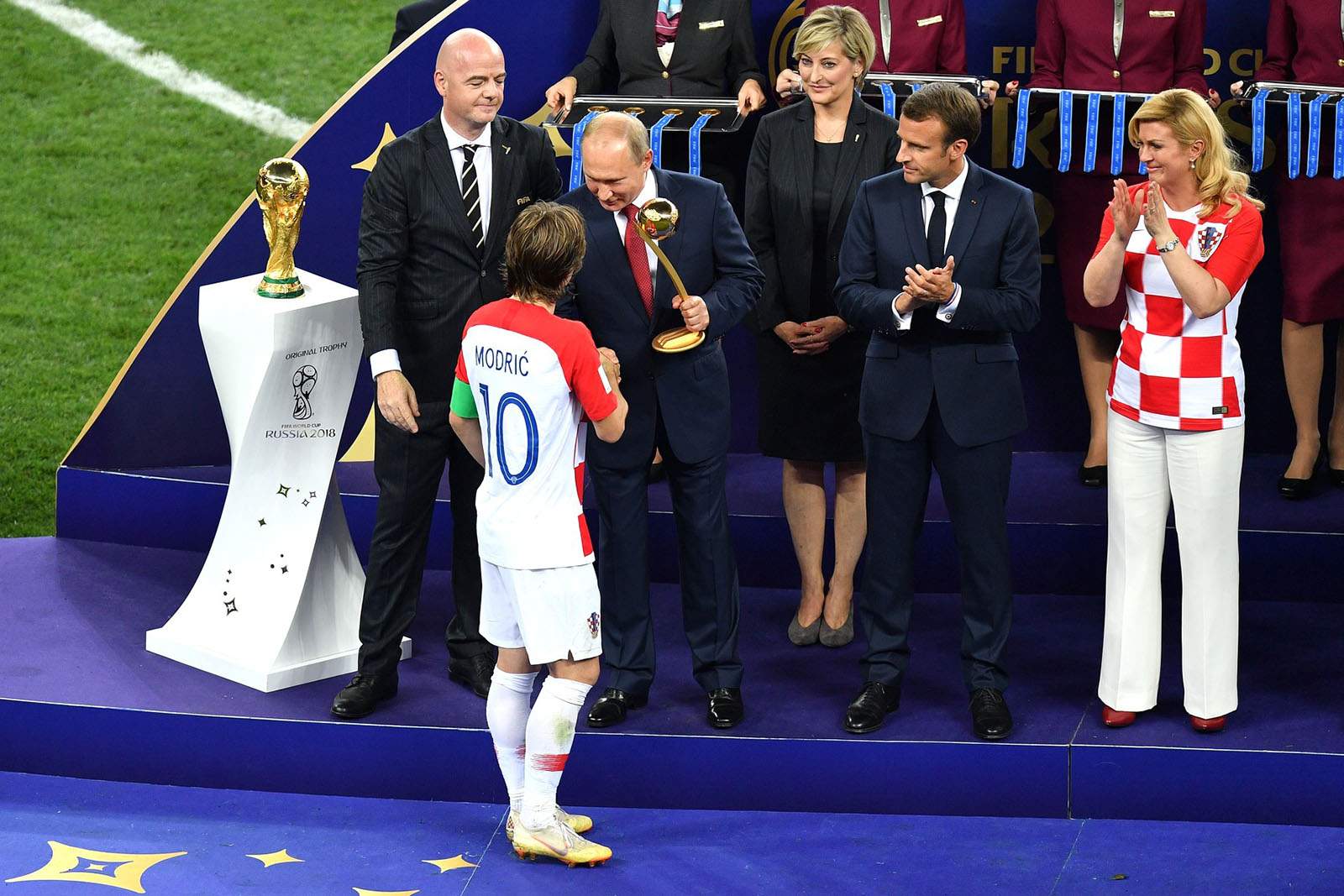 Luka Modric receives the golden ball prize at the hands of Russian President Vladimir Putin