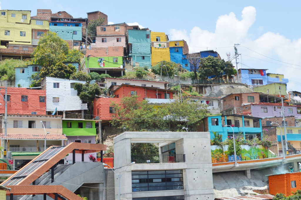Multi coloured houses built into a hill