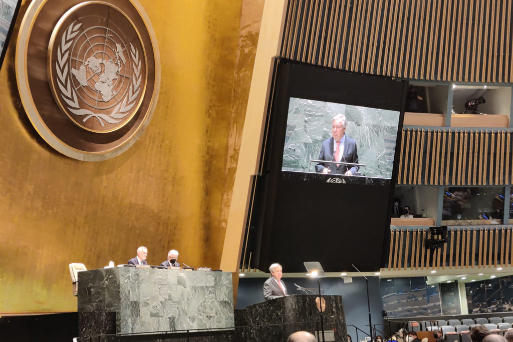 António Guterres, speaking at a podium at the United Nations