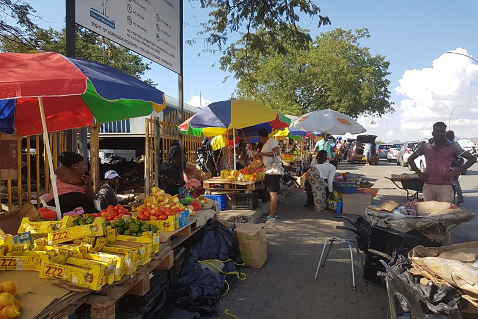 A food market set up on a sidewalk.